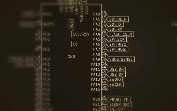 Part of Fieldlogger's schematic, gold on dark: the controller's pins for the stream probe and the battery monitor, fading into shadow.